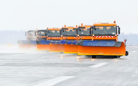 snowplows in the work on the runway at the airport picture id853646866