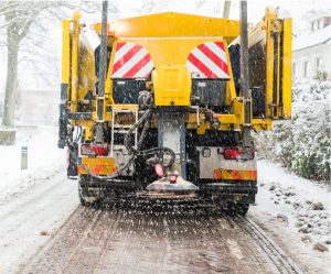 winter road maintenance truck spreading salt picture id1052940510