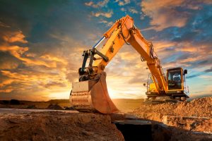 Excavator at a construction site against the setting sun. 143918313 5000x38602